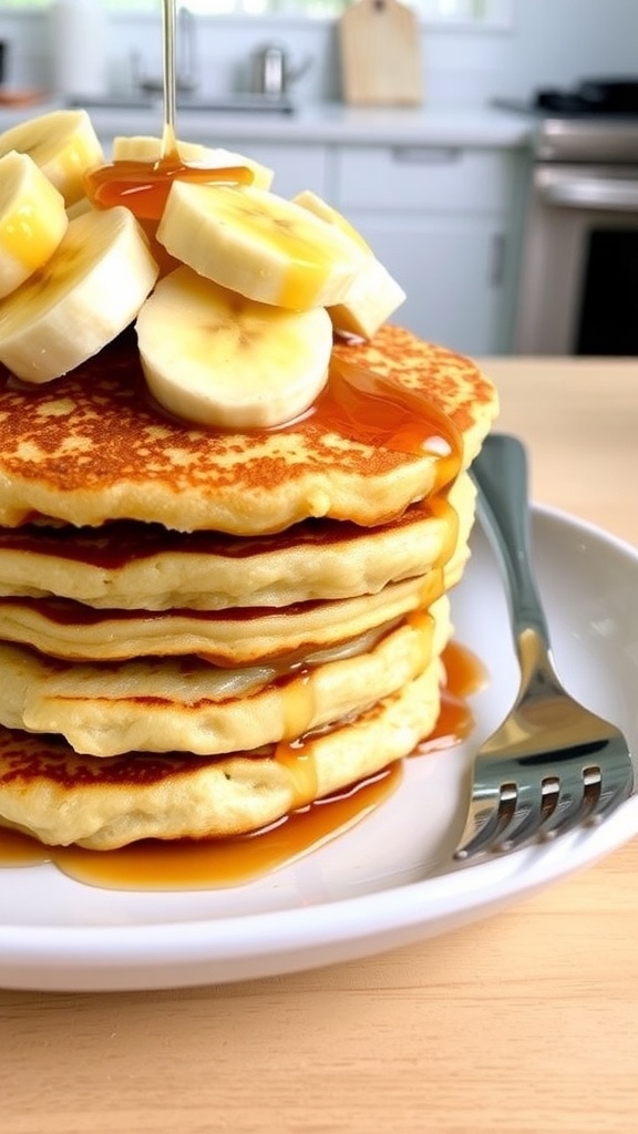 Fluffy oat pancakes topped with banana slices and maple syrup on a white plate.